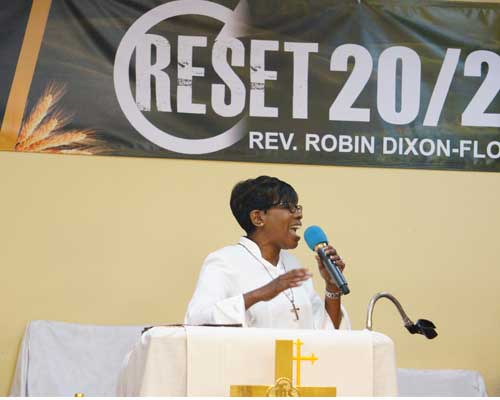 rev robin dixon-floyd speaking at a conference