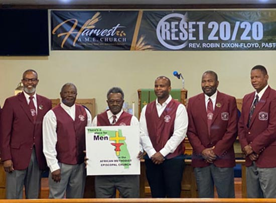 group of men wearing church clothes and smiling 